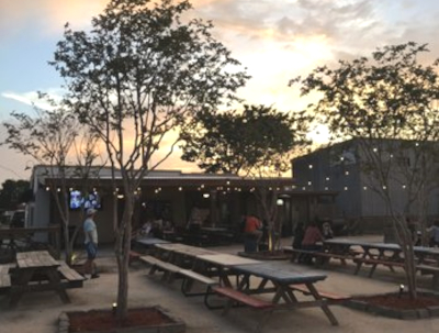 Picture of back yard patio for a restaurant and bar at sunset