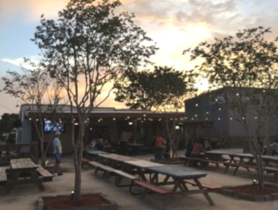Picture of back yard patio for a restaurant and bar at sunset